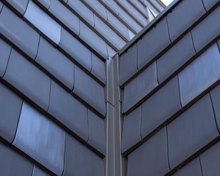 Bardage en façade avec de la tuile HP 10 Huguenot Edilians